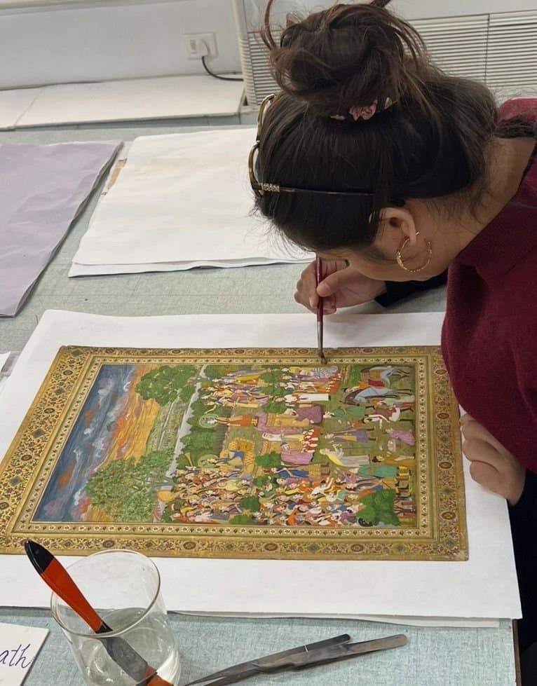 Inpainting a Mughal miniature painting under a fine brush